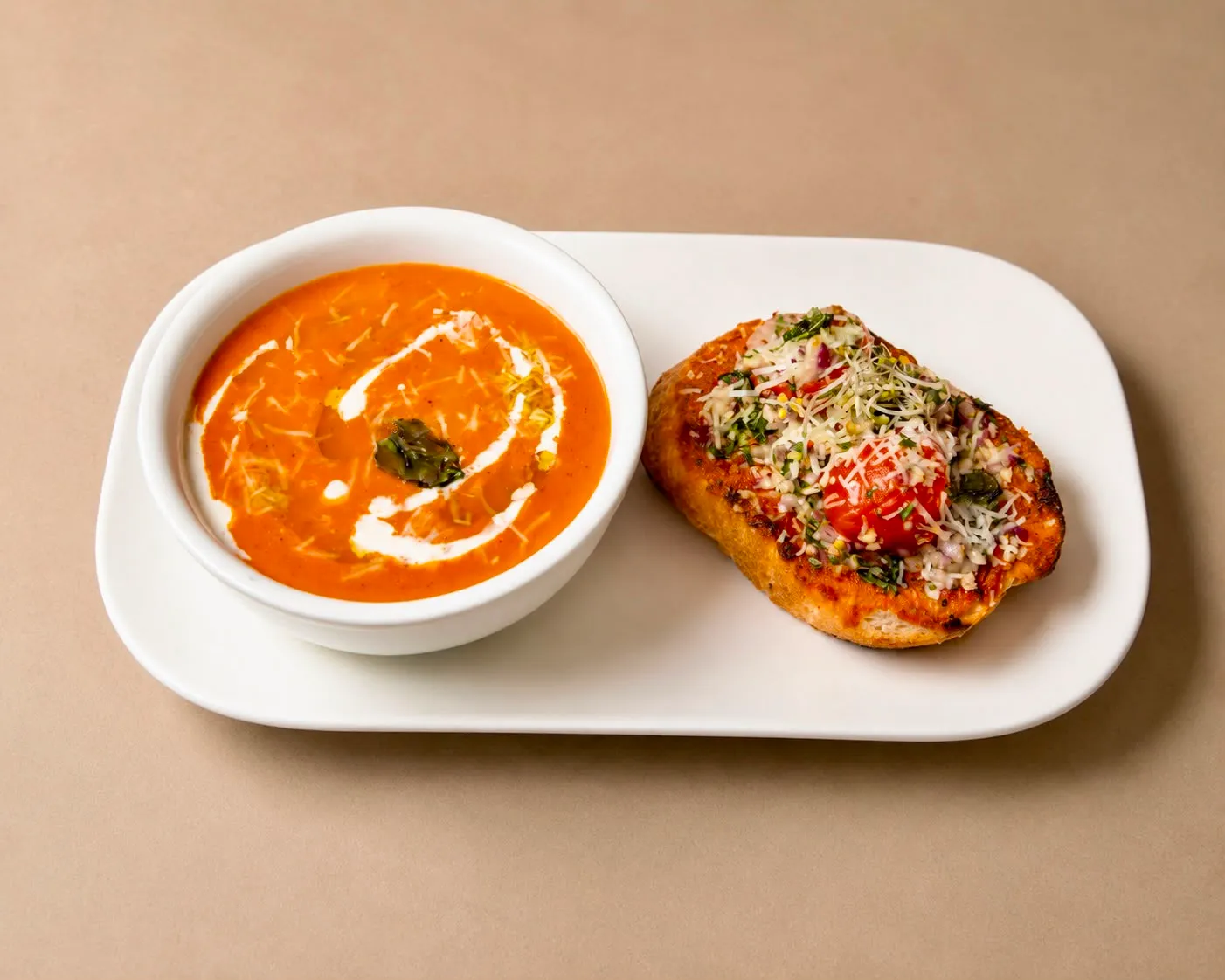Tomato basil soup with a parmesan and herb-crusted baguette at The House on Queen&rsquo;s (HQ) in downtown London, Ontario